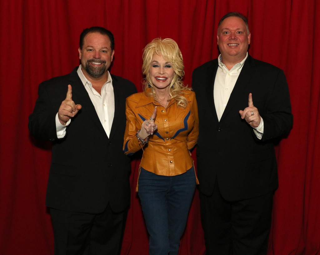 Left to right: Danny Nozell, CEO, CTK Management; Dolly Parton; and, Kirt Webster, President/CEO, Webster Public Relations