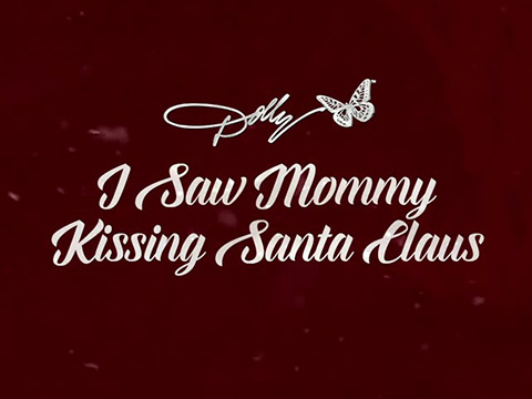 Dolly Parton Releases Her Whimsical Take On Christmas Classic “I Saw Mommy Kissing Santa Claus”